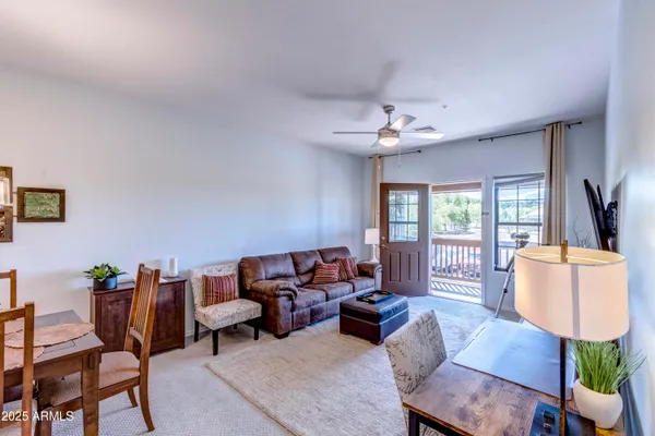 a kitchen with stainless steel appliances granite countertop a sink a stove a refrigerator a washer and dryer