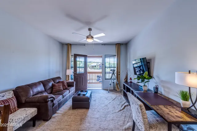 a kitchen with stainless steel appliances a refrigerator a sink a stove and cabinets