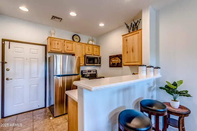 a view of a balcony with couches and wooden floor