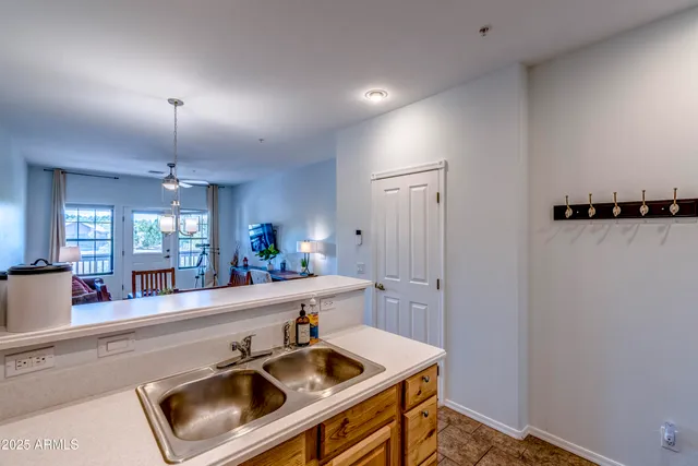 a view of a house with backyard sitting area and garden