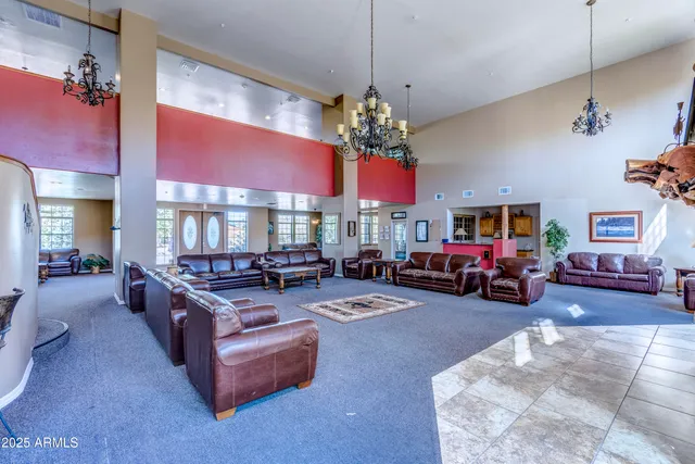 a front view of a building with a garden and plants