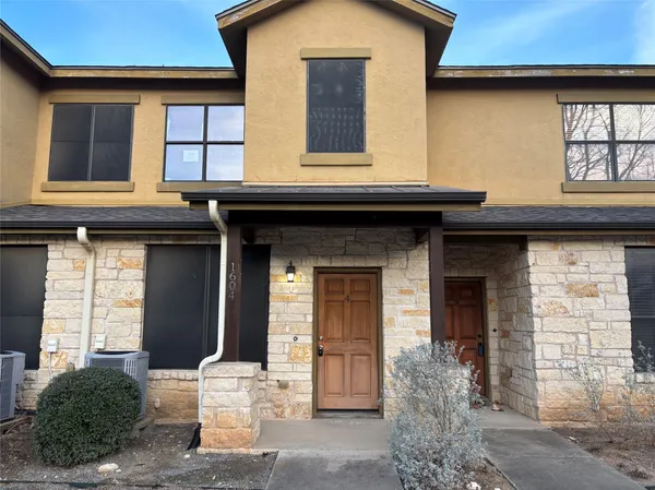 a front view of a house with a porch