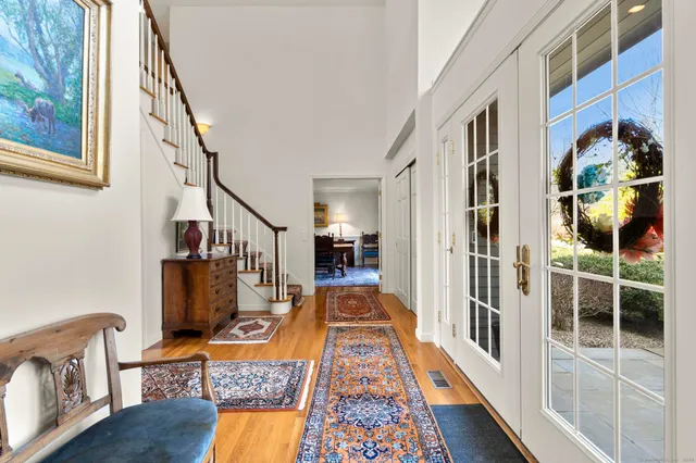 a living room with furniture rug and window