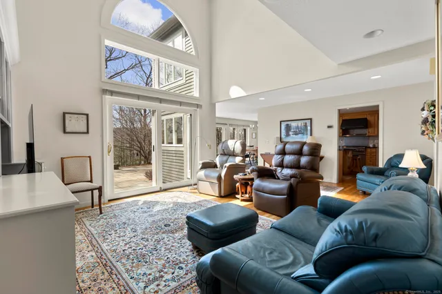 a view of a livingroom with workspace and a window