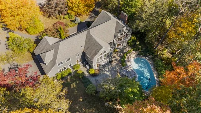 a backyard of a house with lots of trees