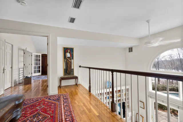 a living room with furniture fireplace and rug