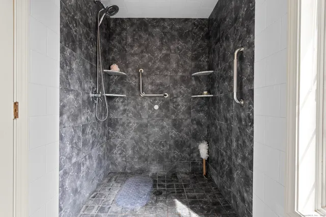 a bed room with a bed and a table