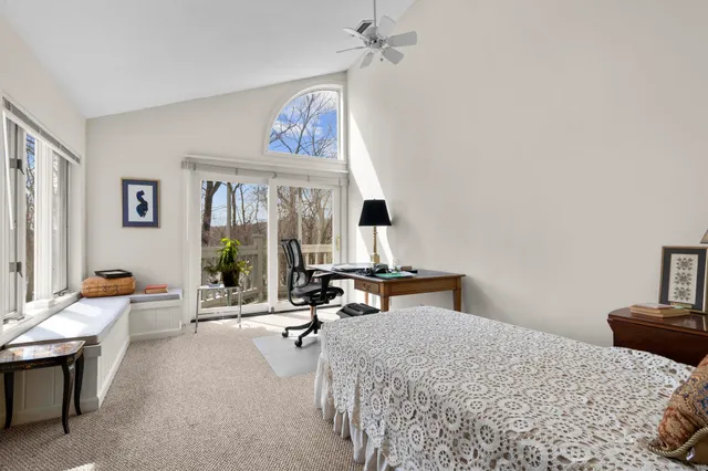 a bedroom with a bed and a couch