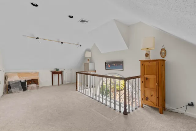 a spacious bathroom with a double vanity sink a mirror and a shower