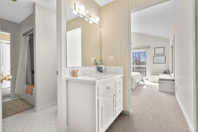 a picture of a bathroom with a shower