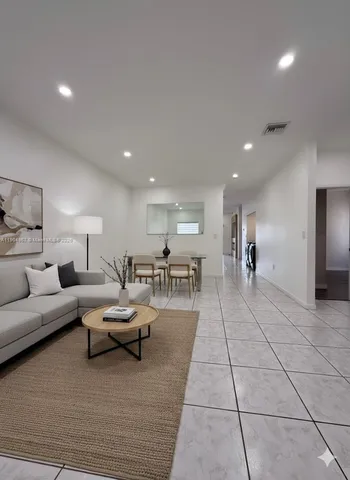 a living room with furniture and a table