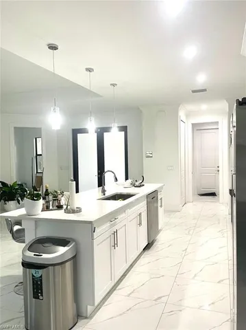 a large bathroom with a sink and a mirror