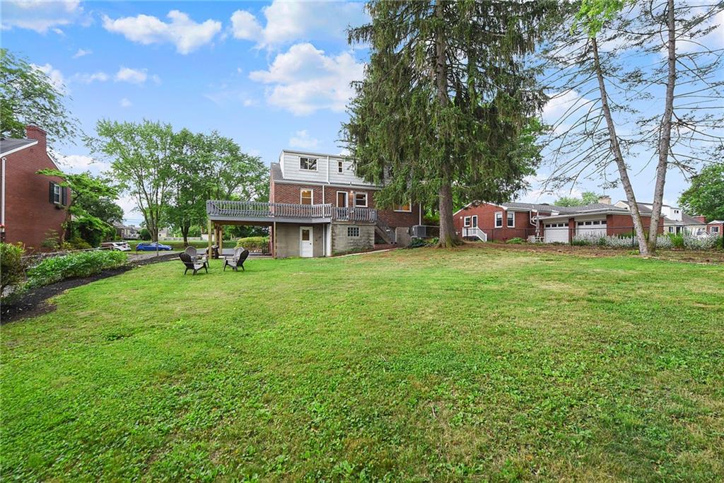 3316 Ivanhoe Road Pittsburgh, PA 15241 - Photo 33 of 37 a view of a house with a big yard and large trees