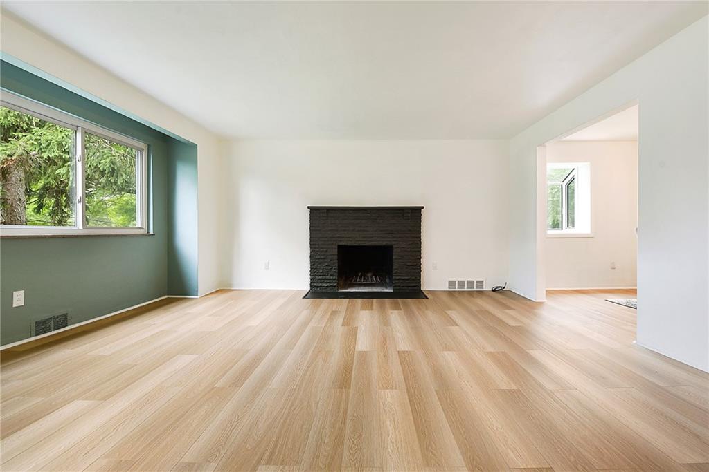 3316 Ivanhoe Road Pittsburgh, PA 15241 - Photo 4 of 37 a view of an empty room with a fireplace and a window