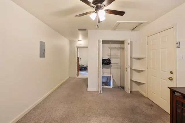 a view of an empty room with a bathroom