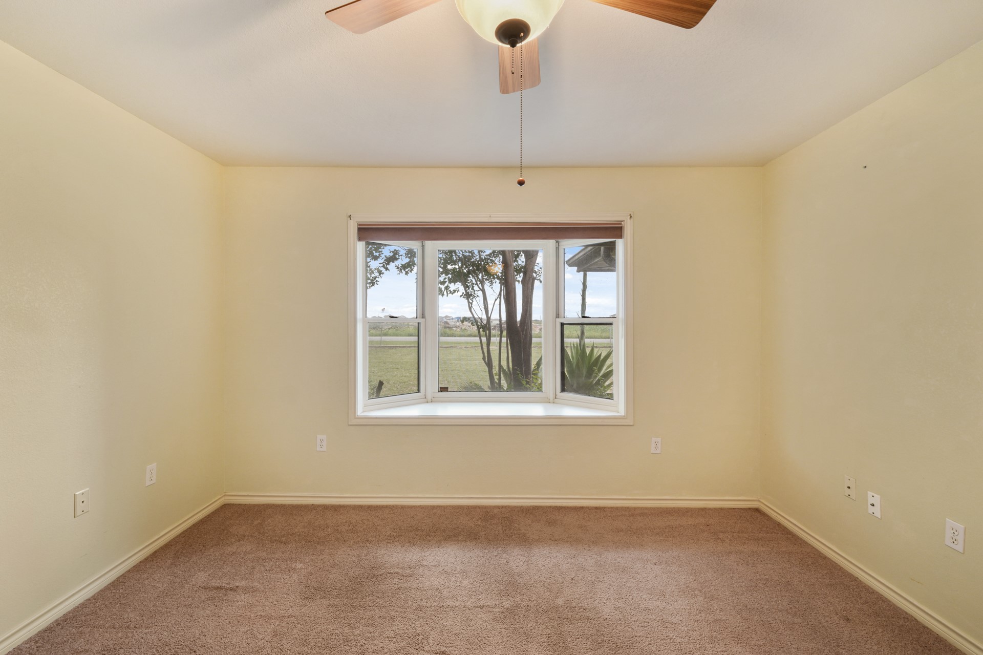 6625 East Post Road Kyle, TX 78640 - Photo 28 of 46 an empty room with a window
