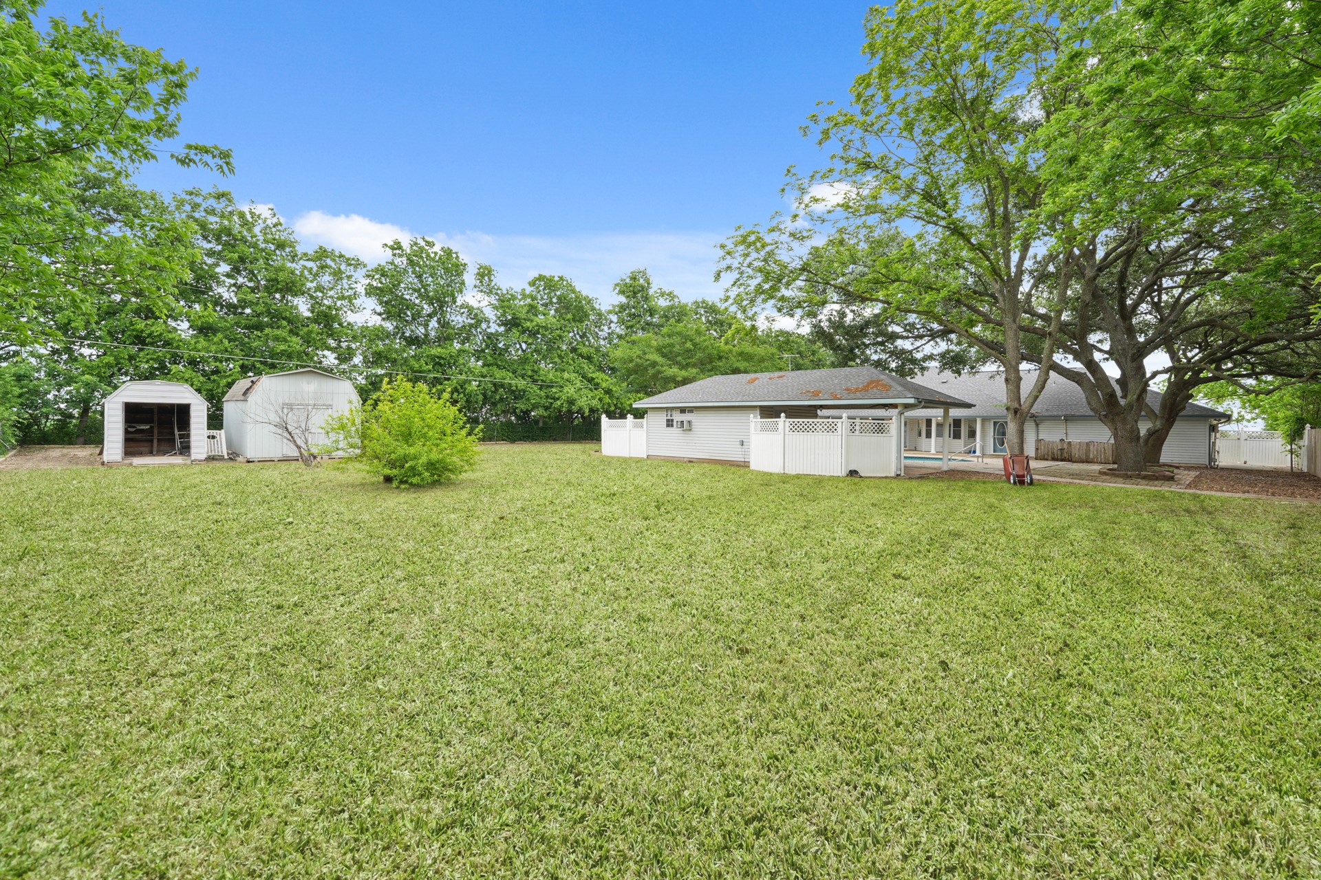6625 East Post Road Kyle, TX 78640 - Photo 34 of 46 a front view of a house with yard and green space