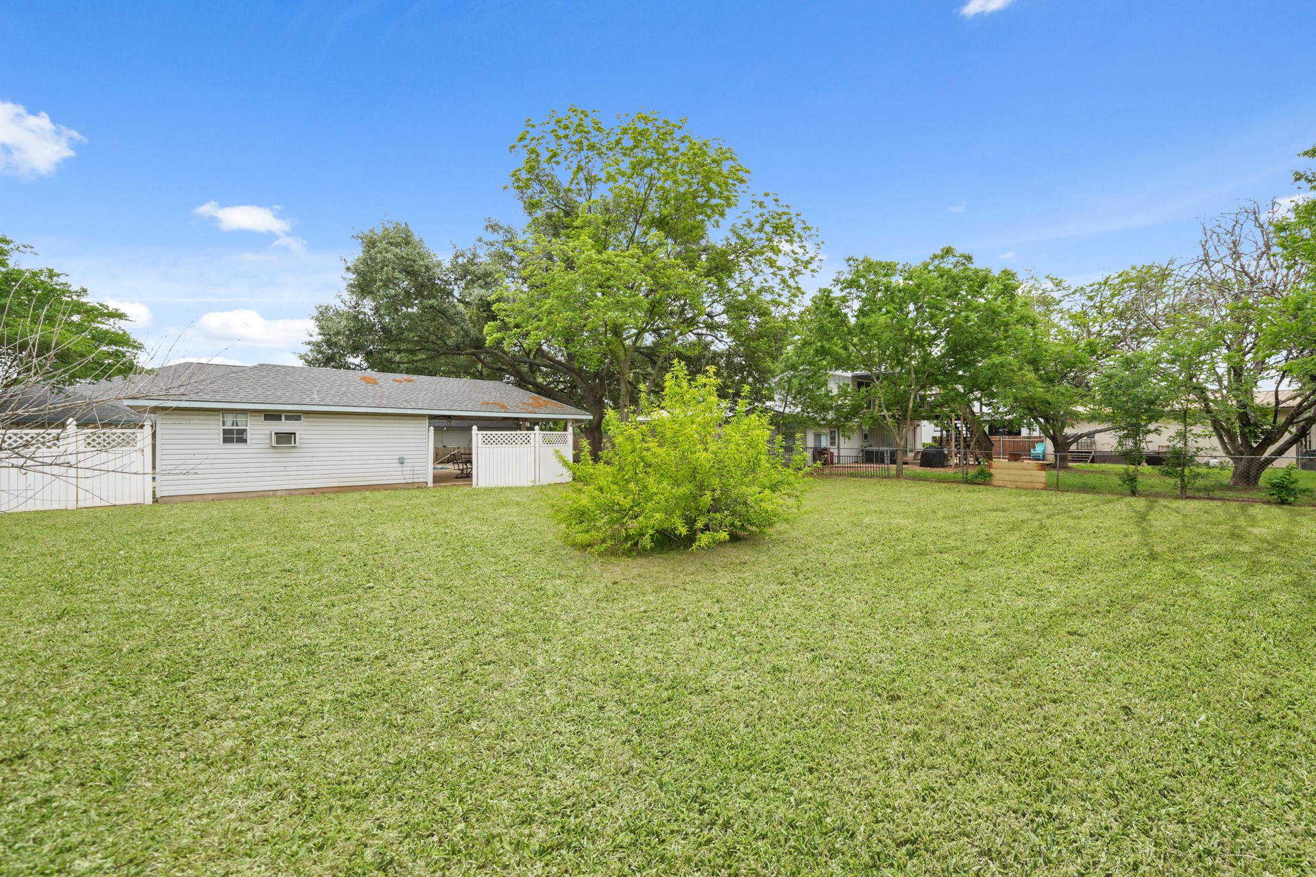 6625 East Post Road Kyle, TX 78640 - Photo 35 of 46 a view of a house with a yard