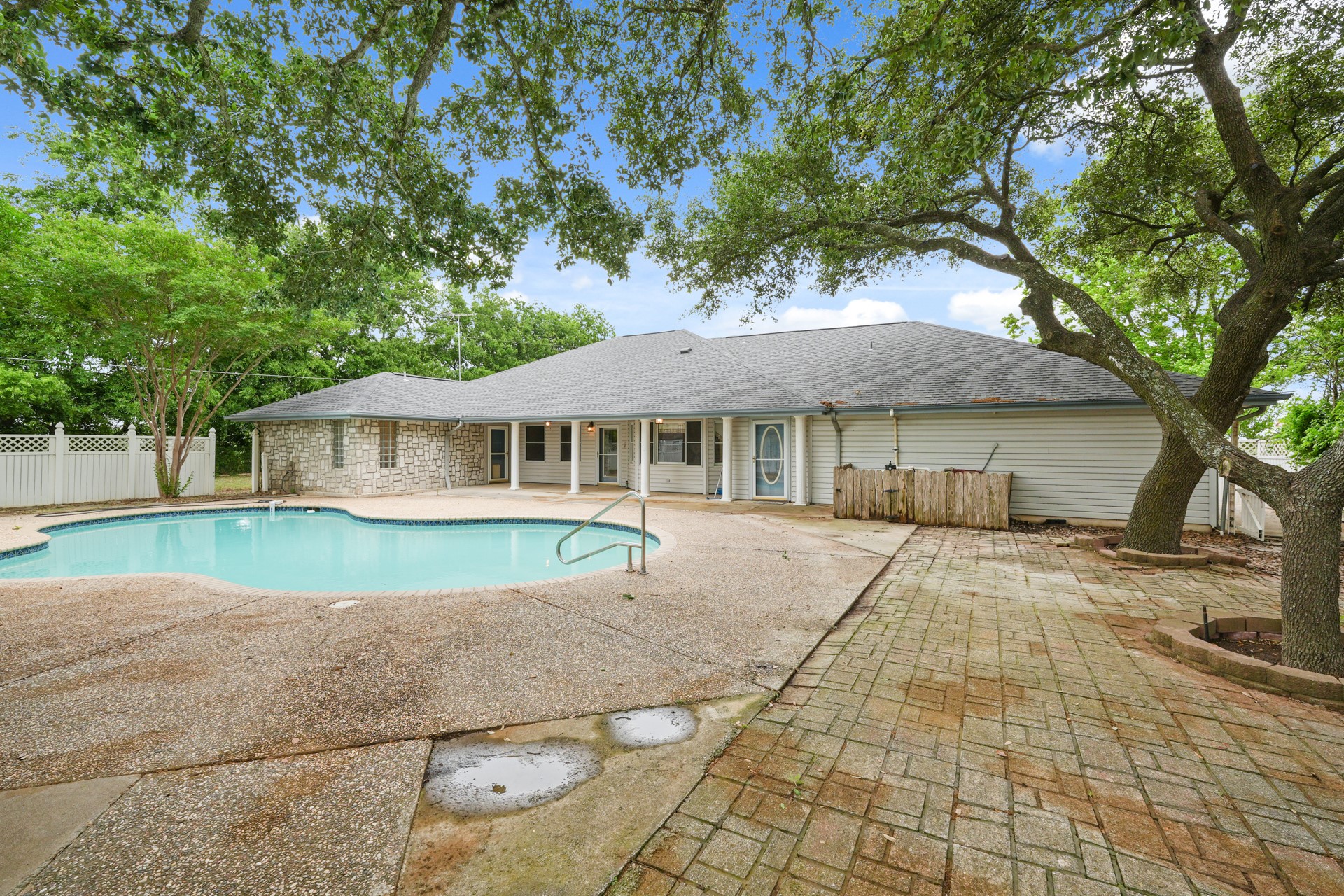6625 East Post Road Kyle, TX 78640 - Photo 37 of 46 a front view of a house with a yard