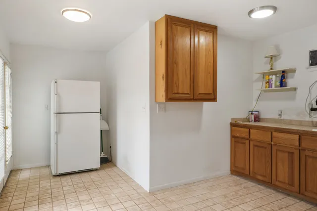 a bathroom with a shower a sink and a mirror