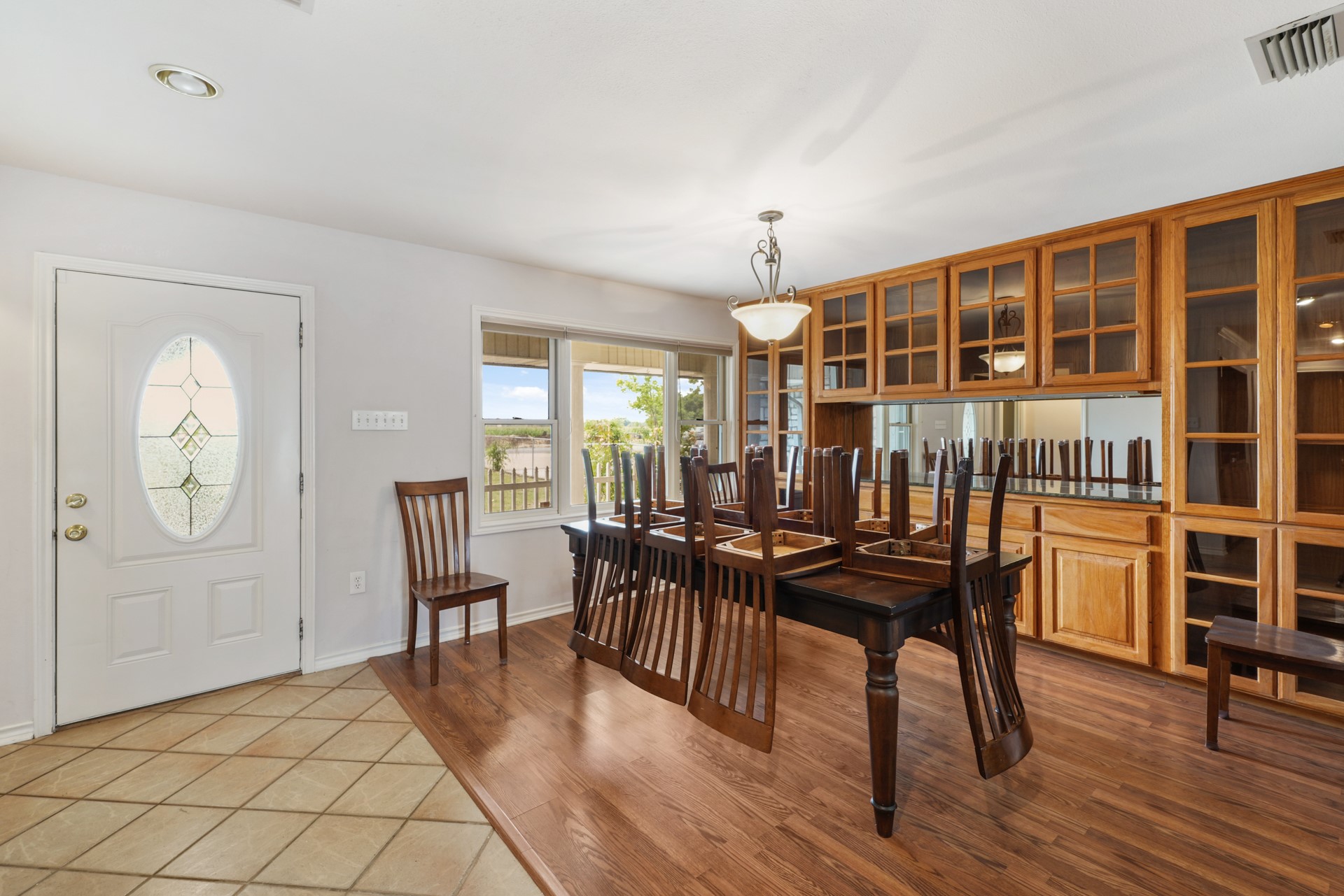 6625 East Post Road Kyle, TX 78640 - Photo 7 of 46 a view of a dining room with furniture window and wooden floor