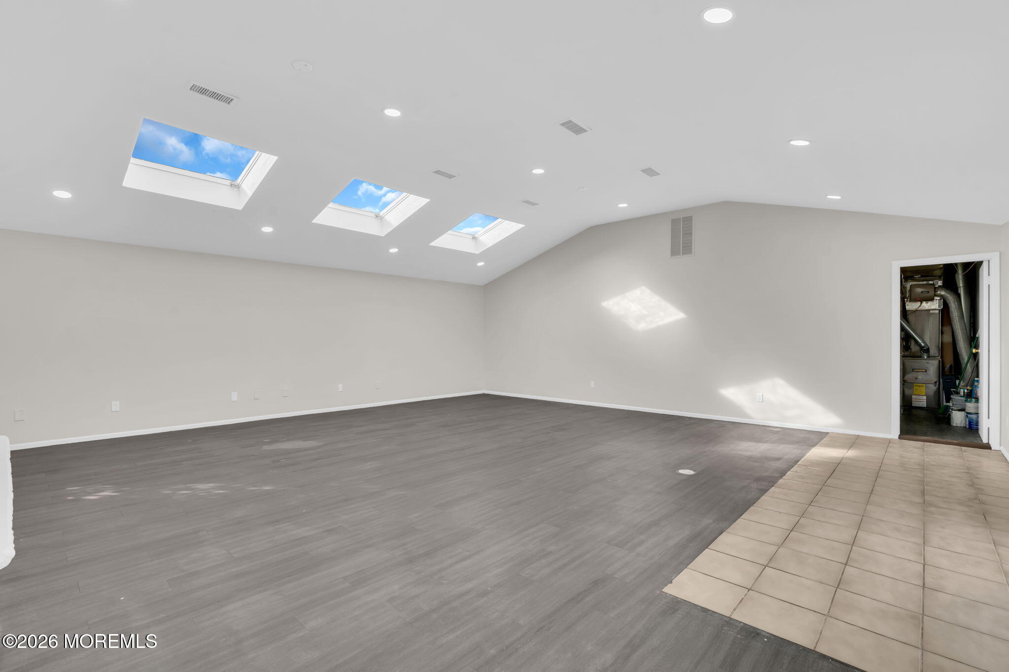 45 Peachstone Road Howell, NJ 07731 - Photo 43 of 54 an empty room with wooden floor and natural light