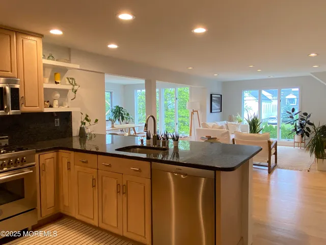 a kitchen with sink and cabinets