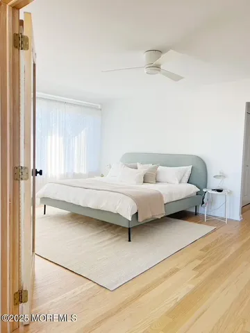 a bedroom with a bed and a table