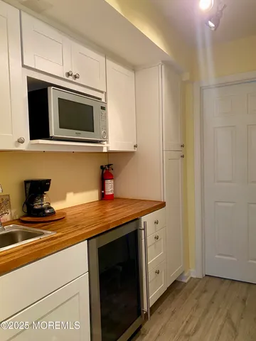 a kitchen with stainless steel appliances granite countertop a sink stove and microwave