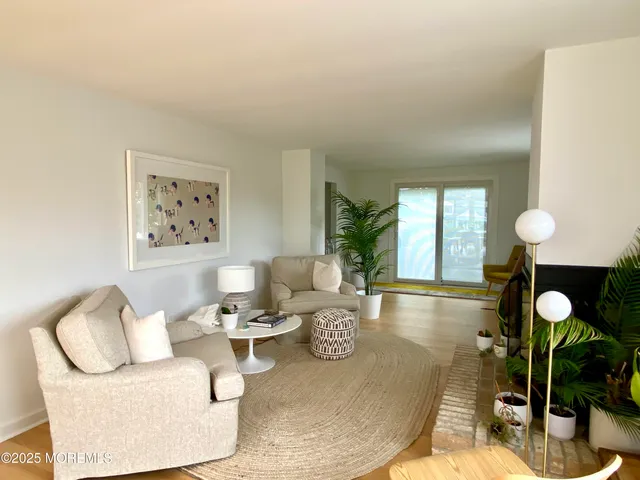 a living room with furniture and window