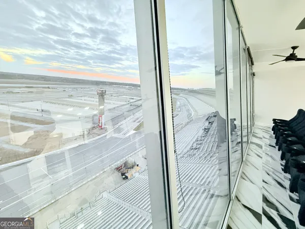 a view of a balcony with wooden floor