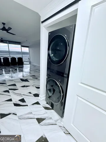 a view of a patio with a table and chairs