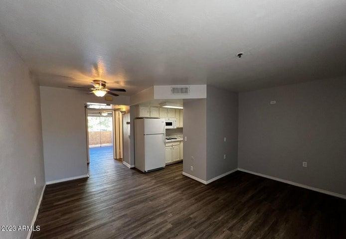 12221 West Bell Road, Unit 224 Surprise, AZ 85378 - Photo 4 of 12 a view of a kitchen with a sink cabinets and wooden floor