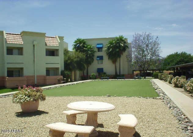 12221 West Bell Road, Unit 224 Surprise, AZ 85378 - Photo 10 of 12 a view of a backyard with plants and patio