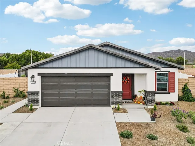 a front view of a house with a patio