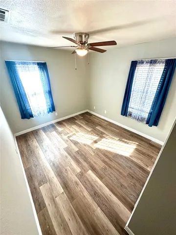 a view of a big room with wooden floor