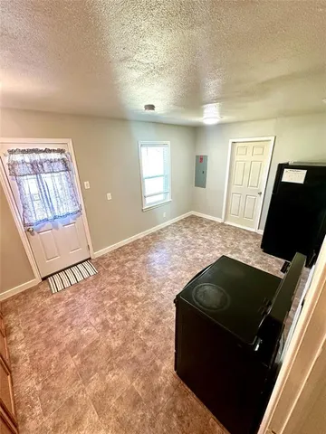 a living room with a couch and a flat screen tv