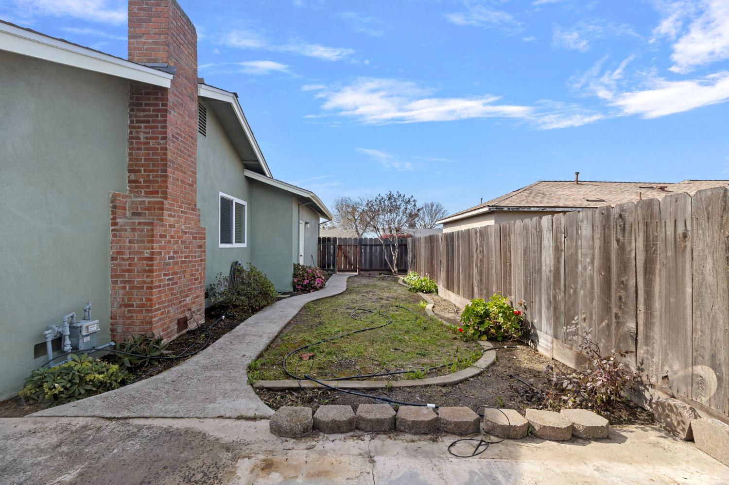 1428 Kent Way Modesto, CA 95355 - Photo 26 of 27 Large side yard that could also be accessed from the front part of the house.