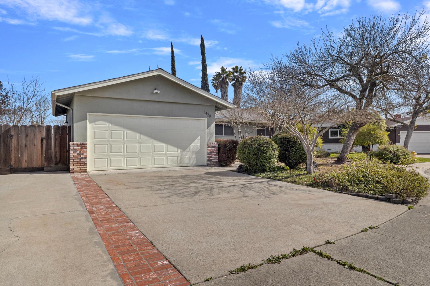 1428 Kent Way Modesto, CA 95355 - Photo 3 of 27 The large driveway is set up perfectly for RV or boat storage either in front of or behind the fence.