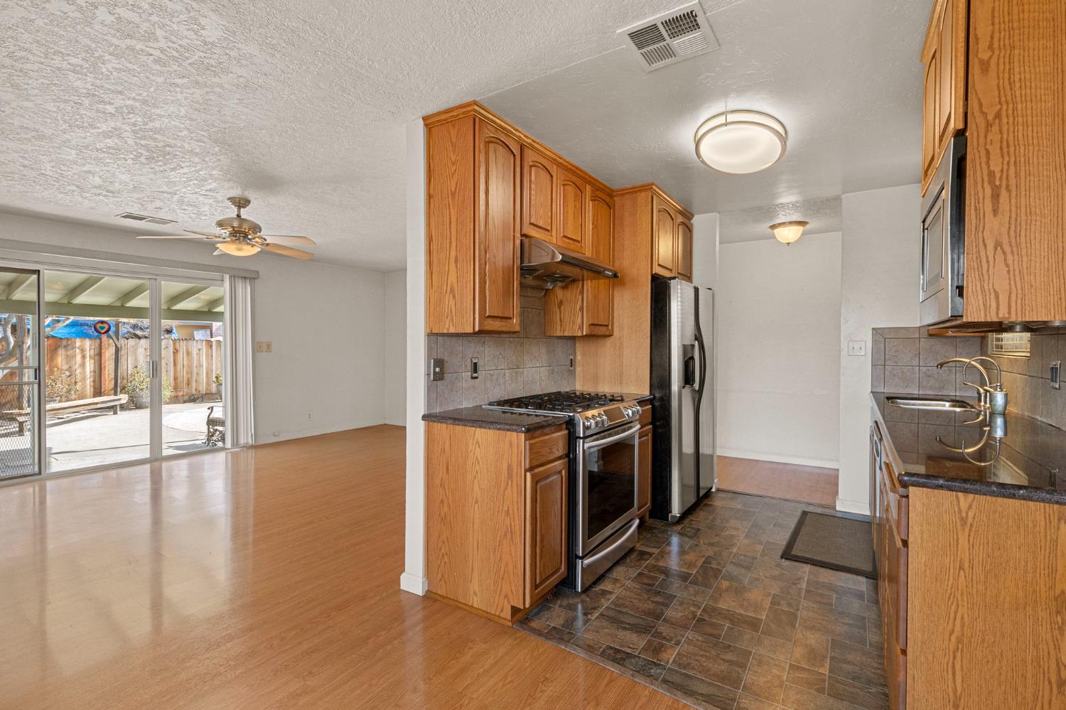 1428 Kent Way Modesto, CA 95355 - Photo 5 of 27 Updated granite counters and stainless appliances will allow you to move right in and start enjoying this home.