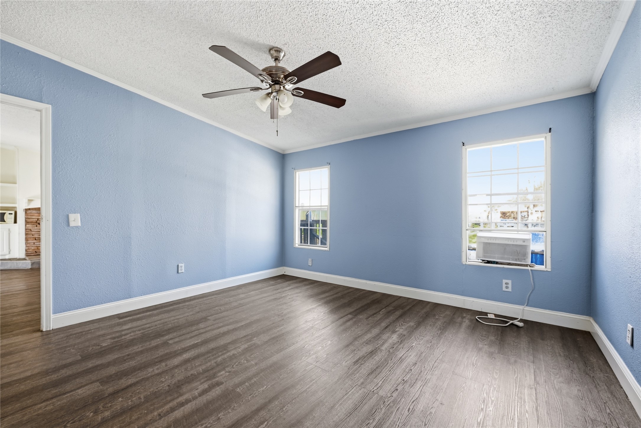 39512 Donigan Road Brookshire, TX 77423 - Photo 14 of 15 a view of an empty room with wooden floor and a window