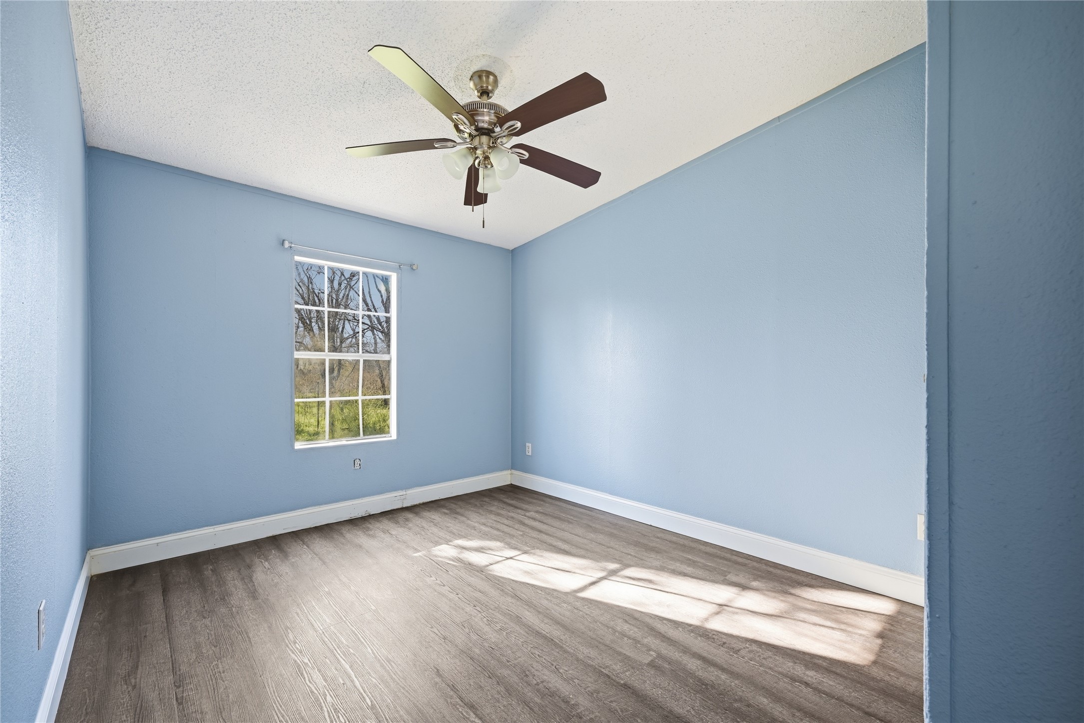 39512 Donigan Road Brookshire, TX 77423 - Photo 5 of 15 a view of a big room with wooden floor and windows