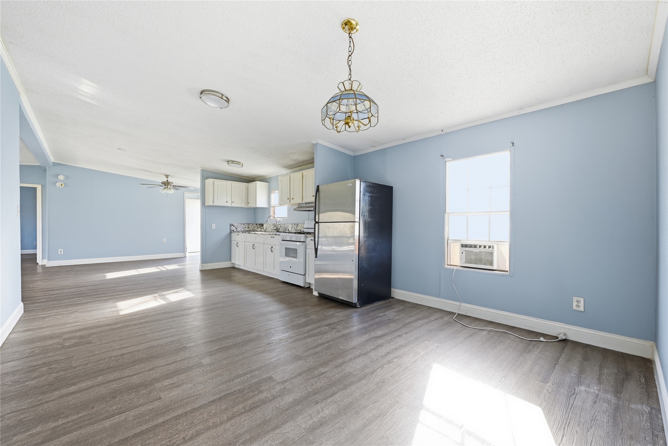 39512 Donigan Road Brookshire, TX 77423 - Photo 9 of 15 a view of a kitchen with a sink dishwasher and a large window