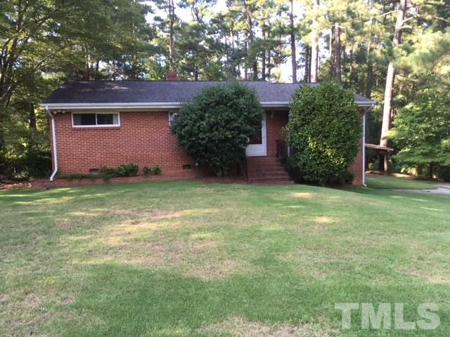 1916 French Drive Raleigh, NC 27612 - Photo 1 of 4 a view of a house with a yard and a large tree