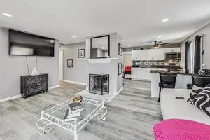a living room with furniture and a fireplace