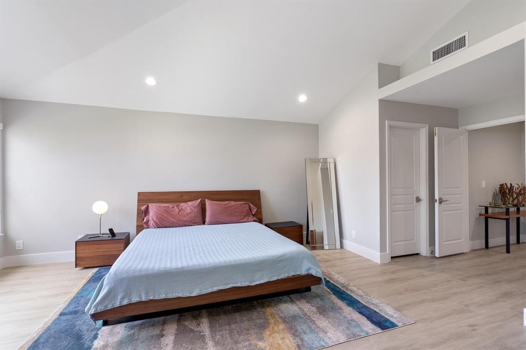 21470 St Andrews Grand Circle, Unit 12 Boca Raton, FL 33486 - Photo 15 of 26 a bedroom with a bed and wooden floor