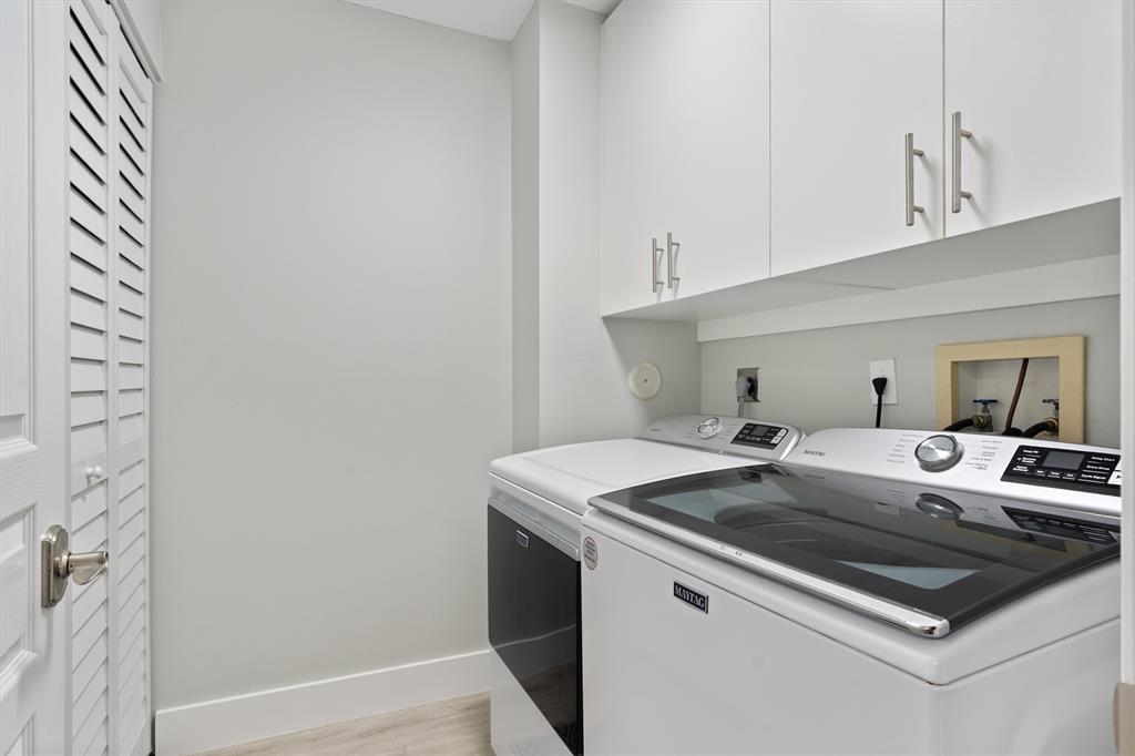 21470 St Andrews Grand Circle, Unit 12 Boca Raton, FL 33486 - Photo 24 of 26 a utility room with washer and dryer