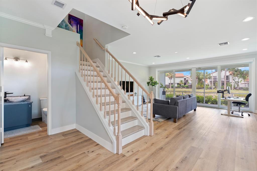 21470 St Andrews Grand Circle, Unit 12 Boca Raton, FL 33486 - Photo 3 of 26 a living room with furniture and wooden floor