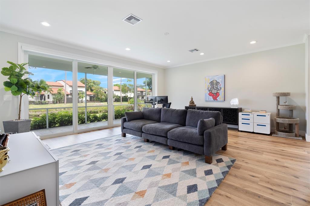 21470 St Andrews Grand Circle, Unit 12 Boca Raton, FL 33486 - Photo 5 of 26 a living room with furniture and a garden
