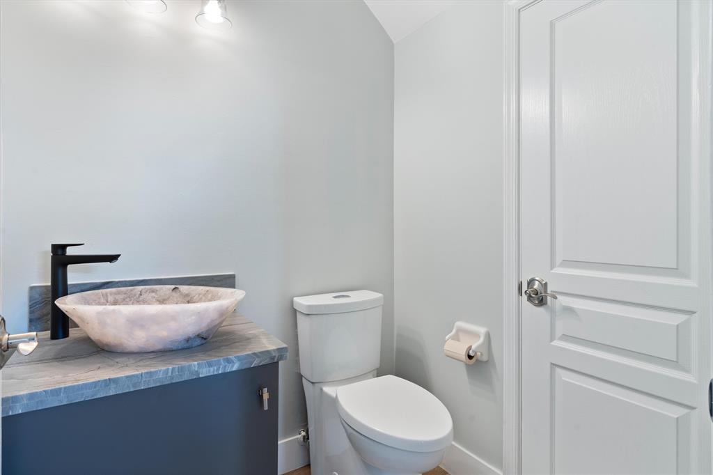 21470 St Andrews Grand Circle, Unit 12 Boca Raton, FL 33486 - Photo 10 of 26 a white toilet sitting next to a bathroom sink